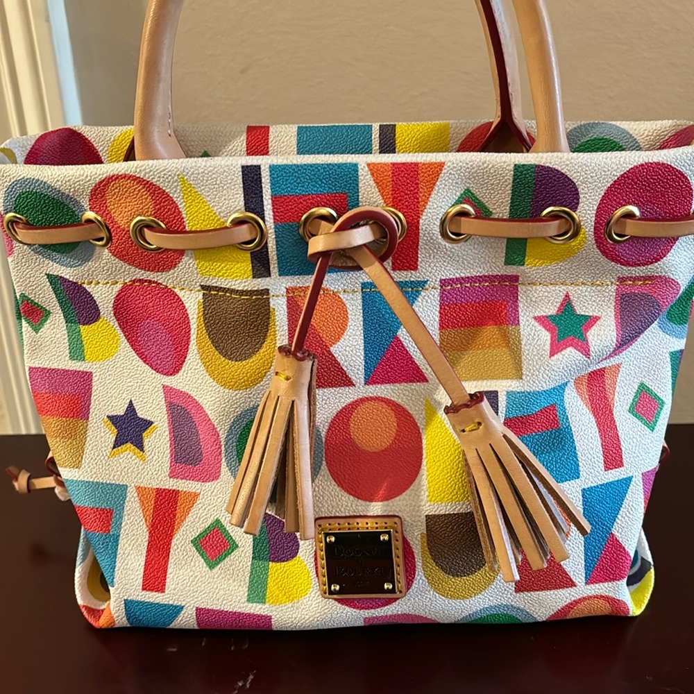 Brand New Dooney and Bourke Art Deco Tassel Purse